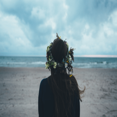 Girl in the beach wearing flower crown